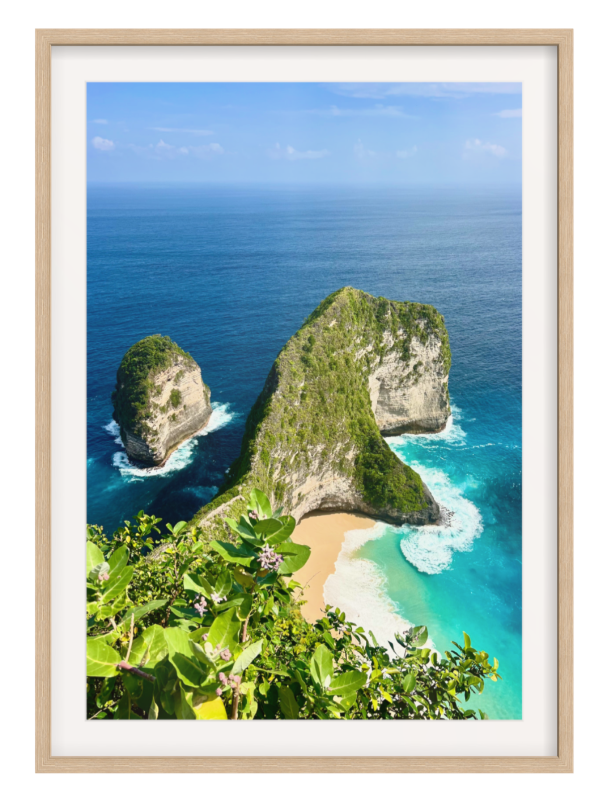 oak Framed photograph of a tropical island with rocky outcrops and a sandy beach.