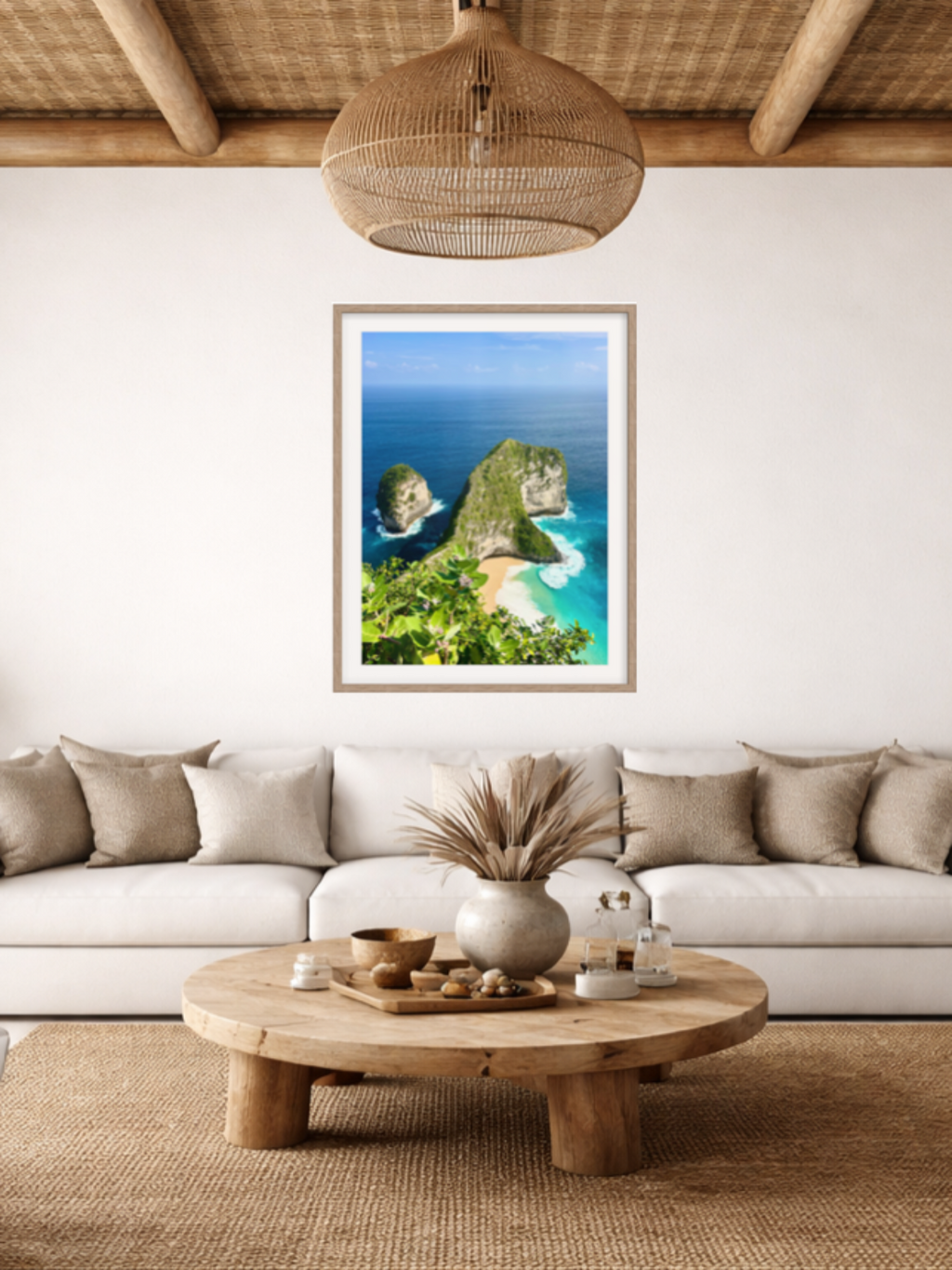 Modern living room with a white sofa, wooden coffee table, and a scenic wall art of a beach.