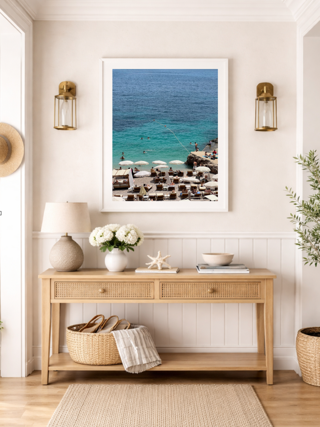 Nautical-themed room with a wooden console table, lamp, and decorative items.