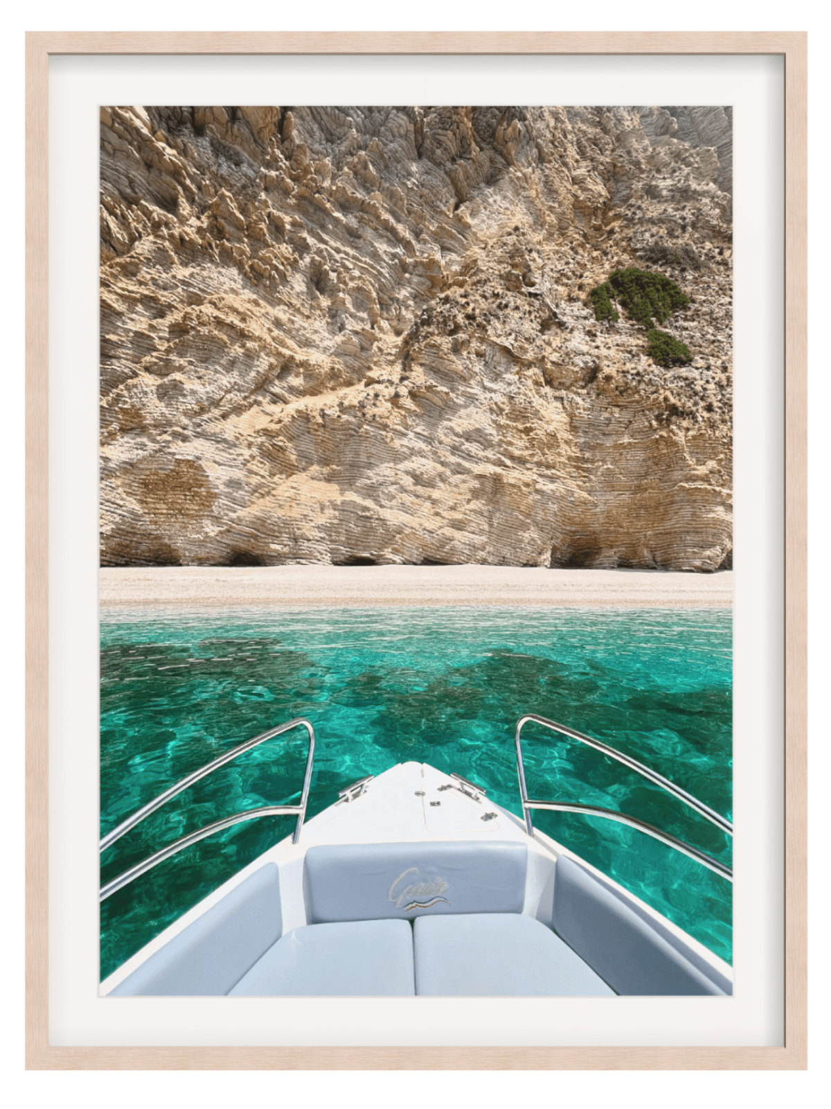 Boat on clear blue water with rocky cliffs in the background