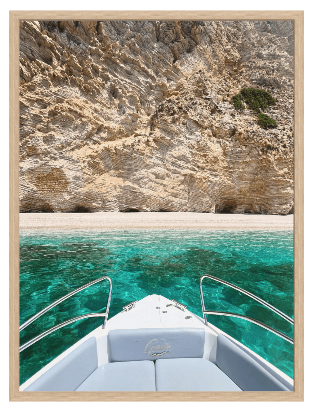 Boat on turquoise water with rocky cliffs in the background