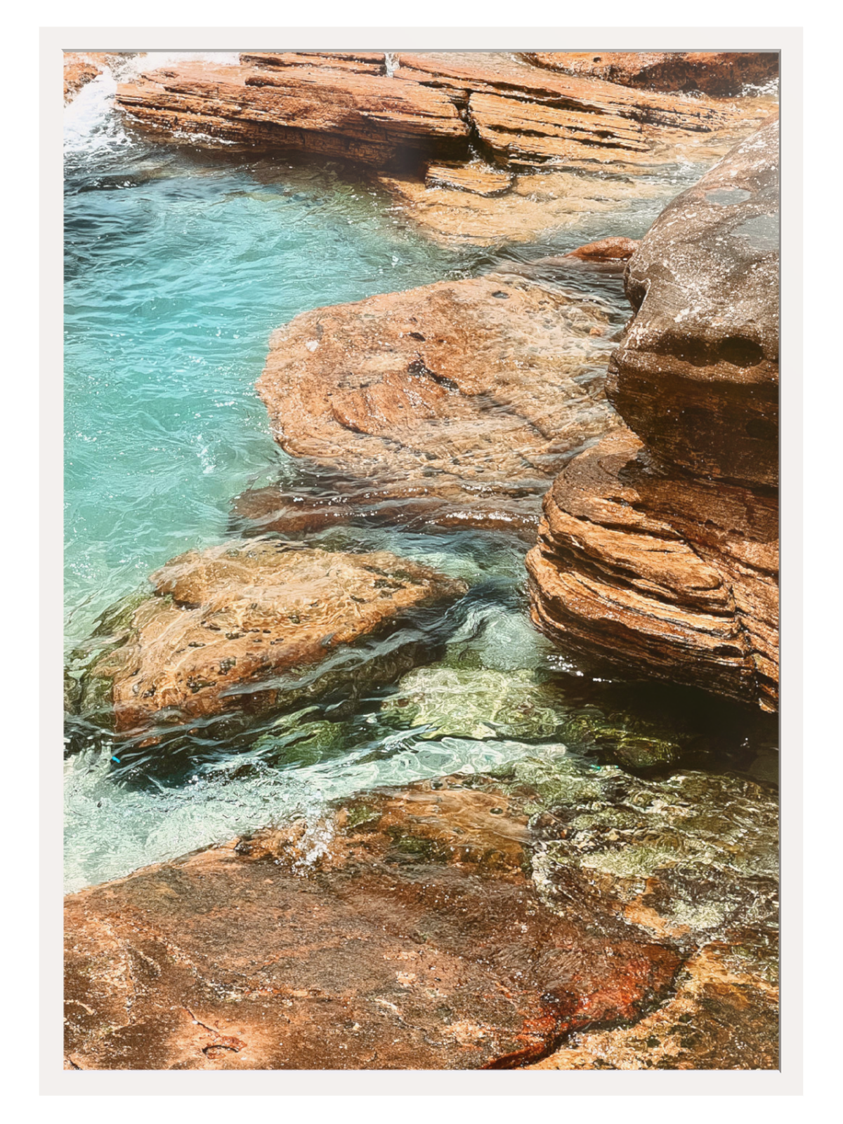 Clear blue water with rocky formations